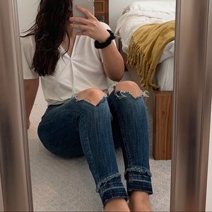 Distressed mid rise blue straight/skinny jeans